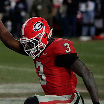 Georgia running back Nate Frazier (3) celebrates after driving in for the game winning score during overtime of a NCAA college football game against Georgia Tech in Athens, Ga., on Friday, Nov. 29, 2024.