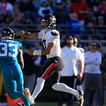 Houston Texans quarterback C.J. Stroud (7) throws the ball against Jacksonville Jaguars linebacker Devin Lloyd (33) during the third quarter of an NFL football matchup Sunday, Dec. 1, 2024 at EverBank Stadium in Jacksonville, Fla. The Texans held off the Jaguars 23-20. [Corey Perrine/Florida Times-Union]