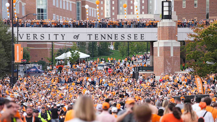 Tennessee fans mingle during the Vol Walk before an NCAA college football game between Tennessee and Mississippi State at Neyland Stadium in Knoxville, Tenn., Saturday, Nov. 3, 2024.