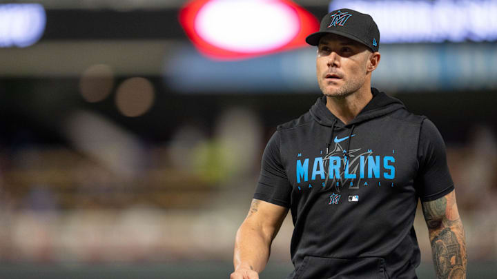 Miami Marlins manager Skip Schumaker (45) walks back to the dugout in the seventh inning at Target Field. Miami Marlins manager Skip Schumaker (45) walks back to the dugout in the seventh inning at Target Field.