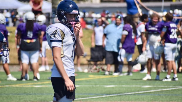 Arlington quarterback Leyton Martin participates in PLU 11v11 Football Showcase on Wednesday in Parkland.