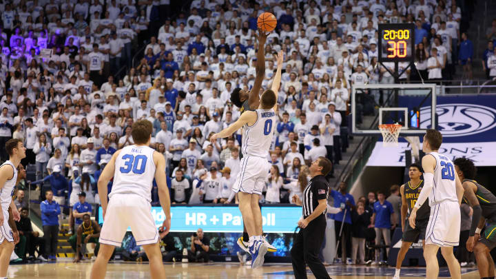 Feb 20, 2024; Provo, Utah, USA; Baylor Bears center Yves Missi (21) and Brigham Young Cougars forward Noah Waterman (0) jump the ball to start the game at Marriott Center. Mandatory Credit: Rob Gray-USA TODAY Sports