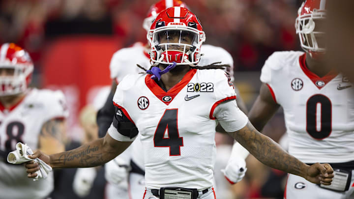 Jan 10, 2022; Indianapolis, IN, USA; Georgia Bulldogs running back James Cook (4) against the Alabama Crimson Tide in the 2022 CFP college football national championship game at Lucas Oil Stadium. Mandatory Credit: Mark J. Rebilas-Imagn Images