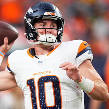 Aug 18, 2024; Denver, Colorado, USA; Denver Broncos quarterback Bo Nix warms up in the first quarter against the Green Bay Packers at Empower Field at Mile High. 