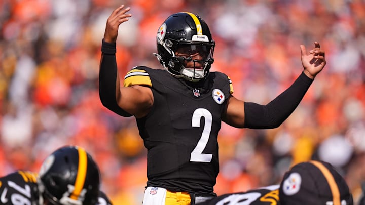 Sep 15, 2024; Denver, Colorado, USA; Pittsburgh Steelers quarterback Justin Fields (2) during the first quarter against the Denver Broncos at Empower Field at Mile High. Mandatory Credit: Ron Chenoy-Imagn Images