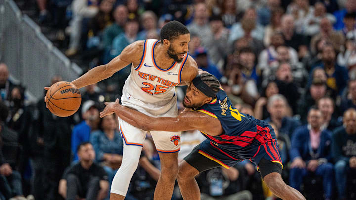 Mar 15, 2025; San Francisco, California, USA; Golden State Warriors guard Moses Moody (4) guards New York Knicks forward Mikal Bridges (25) during the fourth quarter at Chase Center. Mandatory Credit: Neville E. Guard-Imagn Images Mar 15, 2025; San Francisco, California, USA; Golden State Warriors guard Moses Moody (4) guards New York Knicks forward Mikal Bridges (25) during the fourth quarter at Chase Center. Mandatory Credit: Neville E. Guard-Imagn Images