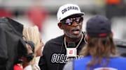 Oct 11, 2025; Boulder, Colorado, USA; Colorado Buffaloes head coach Deion Sanders is interviewed by ESPN during a time out in the first quarter against the Iowa State Cyclones at Folsom Field. Mandatory Credit: Ron Chenoy-Imagn Images