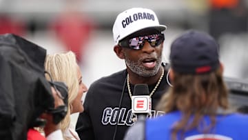 Oct 11, 2025; Boulder, Colorado, USA; Colorado Buffaloes head coach Deion Sanders is interviewed by ESPN during a time out in the first quarter against the Iowa State Cyclones at Folsom Field. Mandatory Credit: Ron Chenoy-Imagn Images