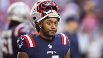Dec 15, 2024; Glendale, Arizona, USA; New England Patriots running back Antonio Gibson (4) against the Arizona Cardinals at State Farm Stadium. Mandatory Credit: Mark J. Rebilas-Imagn Images