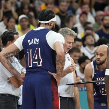 Jul 28, 2024; Villeneuve-d'Ascq, France; United States head coach Steve Kerr talks to the team during a timeout  in the first quarter against Serbia during the Paris 2024 Olympic Summer Games at Stade Pierre-Mauroy. 