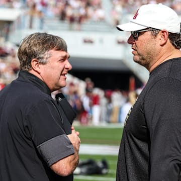 Nov 8, 2025; Starkville, Mississippi, USA; Georgia Bulldogs head coach Kirby Smart and Mississippi State Bulldogs head coach Jeff Lebby talk before the game at Davis Wade Stadium at Scott Field. Mandatory Credit: Wesley Hale-Imagn Images