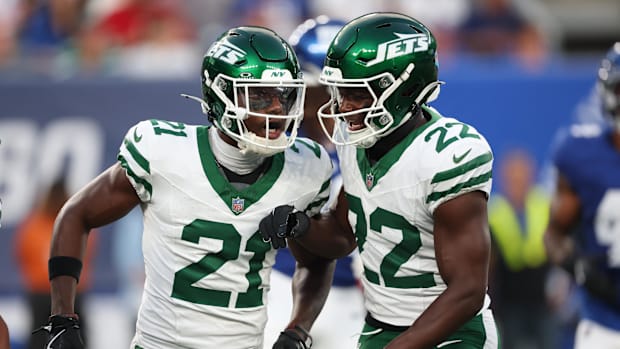 New York Jets cornerback Brandon Stephens celebrates a defensive stop with safety Tony Adams