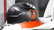 Mar 30, 2025; Toronto, Ontario, CAN; A detail view of a Baltimore Orioles batting helmet during a game against the Toronto Blue Jays at Rogers Centre. Mandatory Credit: John E. Sokolowski-Imagn Images