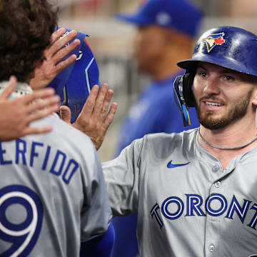 Sep 7, 2024; Atlanta, Georgia, USA; Toronto Blue Jays first baseman Spencer Horwitz (48) celebrates with teammates after scoring a run against the Atlanta Braves in the fifth inning at Truist Park.