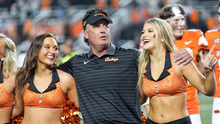 Oklahoma State head coach Mike Gundy stands with the cheer team after an NCAA football game between Oklahoma State (OSU) and UT Martin in Stillwater, Okla., on Thursday, Aug. 28, 2025.