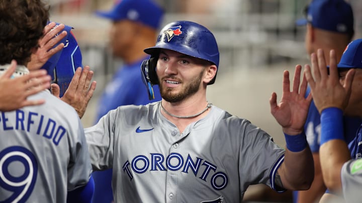 Sep 7, 2024; Atlanta, Georgia, USA; Toronto Blue Jays first baseman Spencer Horwitz (48) celebrates with teammates after scoring a run against the Atlanta Braves in the fifth inning at Truist Park.