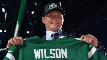 Apr 29, 2021; Cleveland, Ohio, USA; BYU quarterback Zach Wilson poses with jersey after being selected as the second pick by the New York Jets during the 2021 NFL Draft  at First Energy Stadium. Mandatory Credit: Kirby Lee-Imagn Images