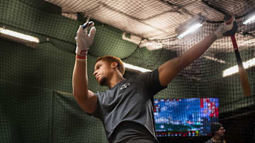 Red Sox prospect Kristian Campbell takes some swings inside the batting cage at Fenway Park on Tuesday.