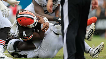 Cleveland Browns quarterback Deshaun Watson (4) is sacked by Jacksonville Jaguars linebacker Foyesade Oluokun (23) during the third quarter of an NFL football matchup Sunday, Sept. 15, 2024 at EverBank Stadium in Jacksonville, Fla. The Browns defeated the Jaguars 18-13. [Corey Perrine/Florida Times-Union]