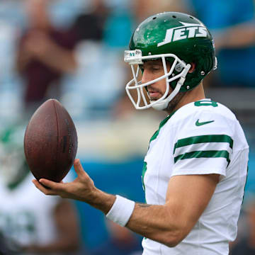 New York Jets quarterback Aaron Rodgers (8) balances a ball before an NFL football matchup Sunday, Dec. 15, 2024 at EverBank Stadium in Jacksonville, Fla. [Corey Perrine/Florida Times-Union]