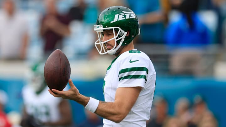 New York Jets quarterback Aaron Rodgers (8) balances a ball before an NFL football matchup Sunday, Dec. 15, 2024 at EverBank Stadium in Jacksonville, Fla.
