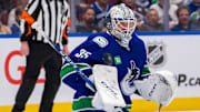 Apr 16, 2024; Vancouver, British Columbia, CAN; Vancouver Canucks goalie Thatcher Demko (35) makes a save against the Calgary Flames in the second period at Rogers Arena. Mandatory Credit: Bob Frid-USA TODAY Sports