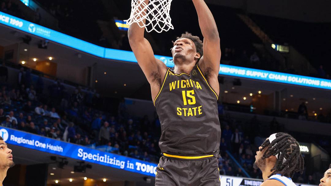 Jan 23, 2025; Memphis, Tennessee, USA; Wichita State Shockers center Quincy Ballard (15) dunks the ball against the Memphis Tigers during the second half at FedExForum. Mandatory Credit: Wesley Hale-Imagn Images Jan 23, 2025; Memphis, Tennessee, USA; Wichita State Shockers center Quincy Ballard (15) dunks the ball against the Memphis Tigers during the second half at FedExForum. Mandatory Credit: Wesley Hale-Imagn Images