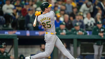 Sep 28, 2024; Seattle, Washington, USA; Oakland Athletics designated hitter Brent Rooker (25) hits a two-run home run during the fifth inning against the Seattle Mariners at T-Mobile Park. Mandatory Credit: Stephen Brashear-Imagn Images