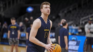 Mar 27, 2025; Atlanta, GA, USA; Michigan Wolverines center Danny Wolf (1) shoots on the court during practice at State Farm Arena.