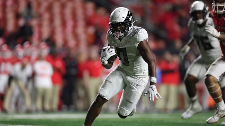Jordon Davison rushed for 100 yards on three carries as Oregon destroyed Rutgers on the road, 56-10.