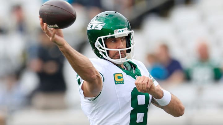 New York Jets quarterback Aaron Rodgers (8) warms up before an NFL football matchup Sunday, Dec. 15, 2024 at EverBank Stadium in Jacksonville, Fla. [Corey Perrine/Florida Times-Union]