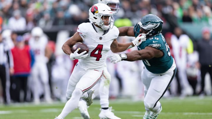 Dec 31, 2023; Philadelphia, Pennsylvania, USA; Arizona Cardinals wide receiver Rondale Moore (4) and Philadelphia Eagles defensive end Brandon Graham (55) in action during the second quarter at Lincoln Financial Field. Mandatory Credit: Bill Streicher-USA TODAY Sports