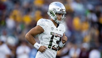 Nov 18, 2023; Tempe, Arizona, USA; Oregon Ducks quarterback Ty Thompson (13) against the Arizona State Sun Devils at Mountain America Stadium. Mandatory Credit: Mark J. Rebilas-USA TODAY Sports