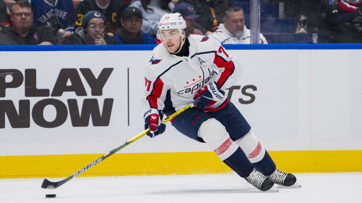 Mar 16, 2024; Vancouver, British Columbia, CAN; Washington Capitals forward TJ Oshie (77) handles the puck against the Vancouver Canucks in the second period at Rogers Arena. Mandatory Credit: Bob Frid-USA TODAY Sports