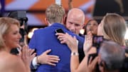 Liam McNeeley embraces Connecticut Huskies head coach Dan Hurley after being selected as the No. 29 pick in the 2025 NBA Draft