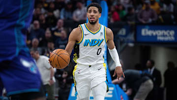 Apr 2, 2025; Indianapolis, Indiana, USA; Indiana Pacers guard Tyrese Haliburton (0) dribbles in the second half against the Charlotte Hornets at Gainbridge Fieldhouse. Mandatory Credit: Trevor Ruszkowski-Imagn Images