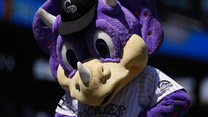 Aug 20, 2025; Denver, Colorado, USA; Colorado Rockies mascot Dinger the Dinosaur performs before the game against the Los Angeles Dodgers at Coors Field. 
