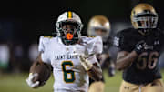 St. Xavier's Marlon Harbin (6) runs the ball down the field during their game against Male on Friday, Sept. 6, 2024 at Male High School in Louisville, Ky.