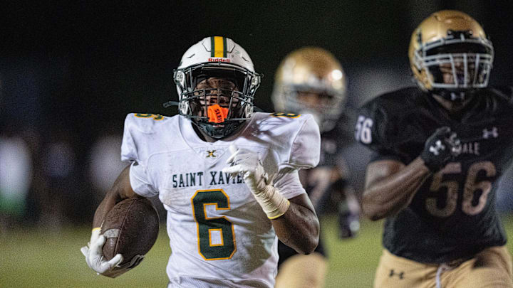 St. Xavier's Marlon Harbin (6) runs the ball down the field during their game against Male on Friday, Sept. 6, 2024 at Male High School in Louisville, Ky.
