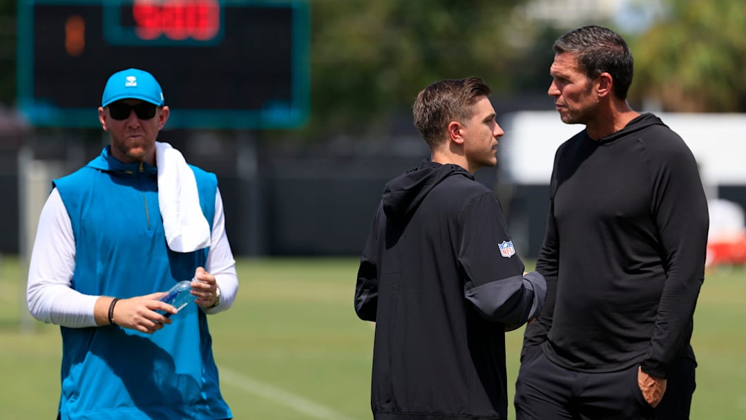 From left, Jacksonville Jaguars head coach Liam Coen, general manager James Gladstone and Tony Boselli, executive vice president of football operations, talk after an NFL training camp session at the Miller Electric Center, Thursday, Aug. 14, 2025 in Jacksonville, Fla.