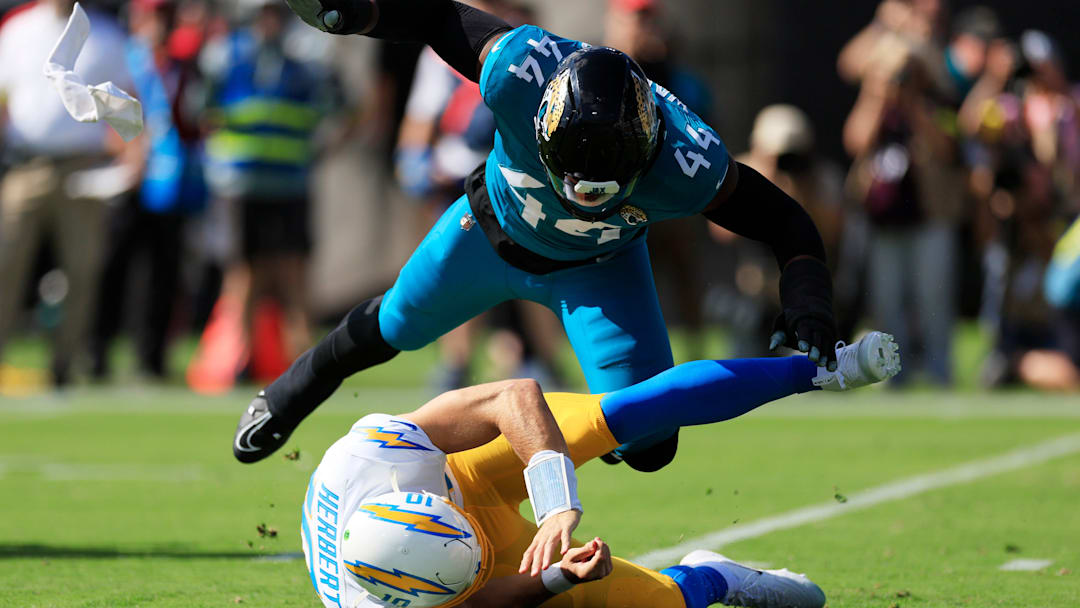 Jacksonville Jaguars defensive end Travon Walker (44) hurries Los Angeles Chargers quarterback Justin Herbert (10) as he is called for intentional grounding during the first quarter of an NFL football game at EverBank Stadium, Sunday, Nov. 16, 2025 in Jacksonville, Fla. [Corey Perrine/Florida Times-Union]