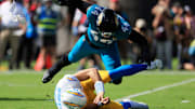 Jacksonville Jaguars defensive end Travon Walker (44) hurries Los Angeles Chargers quarterback Justin Herbert (10) as he is called for intentional grounding during the first quarter of an NFL football game at EverBank Stadium, Sunday, Nov. 16, 2025 in Jacksonville, Fla. [Corey Perrine/Florida Times-Union]