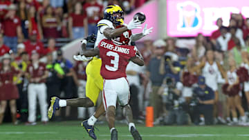 Donaven McCulley with a spectacular catch over Robert Spears-Jennings