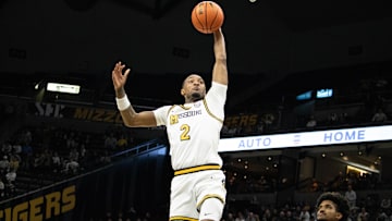 Dec. 3, 2024; Columbia, Mo. USA; Missouri Tigers guard Tamar Bates (2) leaps up for a dunk during a game against the California Golden Bears at Mizzou Arena.