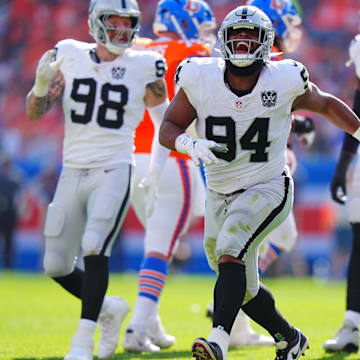 Las Vegas Raiders defensive tackle Christian Wilkins (94) celebrates his sack in the second quarter against the Denver Broncos at Empower Field at Mile High.