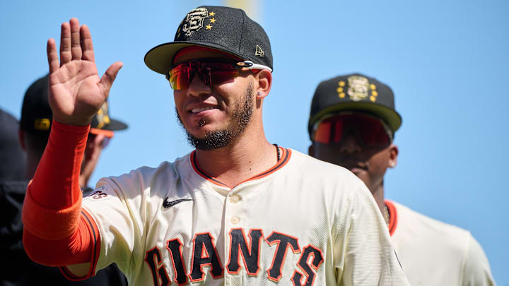 May 19, 2024; San Francisco, California, USA; San Francisco Giants infielder Thairo Estrada (39) shakes hands with his teammates after the last out of the game against the Colorado Rockies Oracle Park. Mandatory Credit: Robert Edwards-Imagn Images