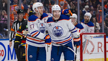 Edmonton Oilers forward Connor McDavid (97) celebrates with forward Zach Hyman (18) 