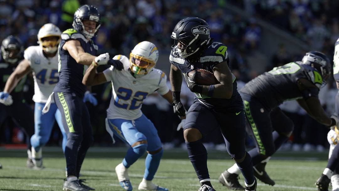 Seattle Seahawks running back Emanuel Wilson (23) runs for a touchdown against the Los Angeles Chargers during the first half at Lumen Field. Seattle Seahawks running back Emanuel Wilson (23) runs for a touchdown against the Los Angeles Chargers during the first half at Lumen Field.
