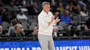 Mar 12, 2025; Charlotte, NC, USA; Stanford Cardinal head coach Kyle Smith applauds his team against the California Golden Bears during the first half at Spectrum Center. Mandatory Credit: Jim Dedmon-Imagn Images