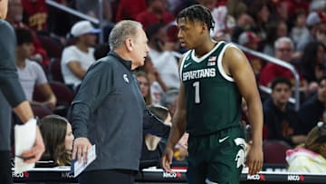 Michigan State Head Coach Tom Izzo talks to  guard Jeremy Fears Jr. (1) on the sideline 